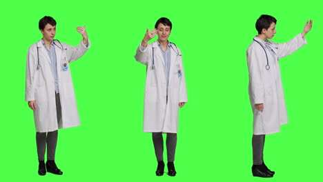Friendly-physician-inviting-people-to-come-closer-to-her-against-greenscreen